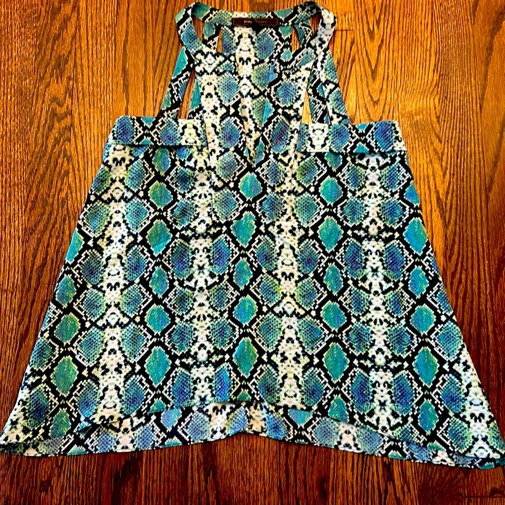 New without tags. Blue/green/turquoise sleeveless flowing top. BCBG MAXAZRIA